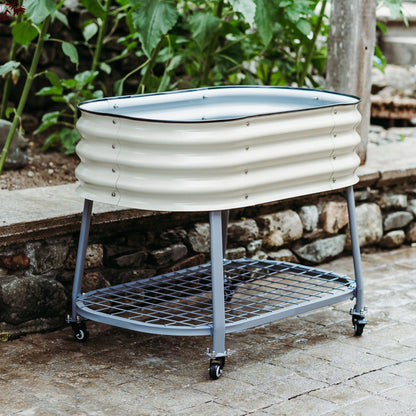 Metal planter with wheels on a patio surrounded by greenery