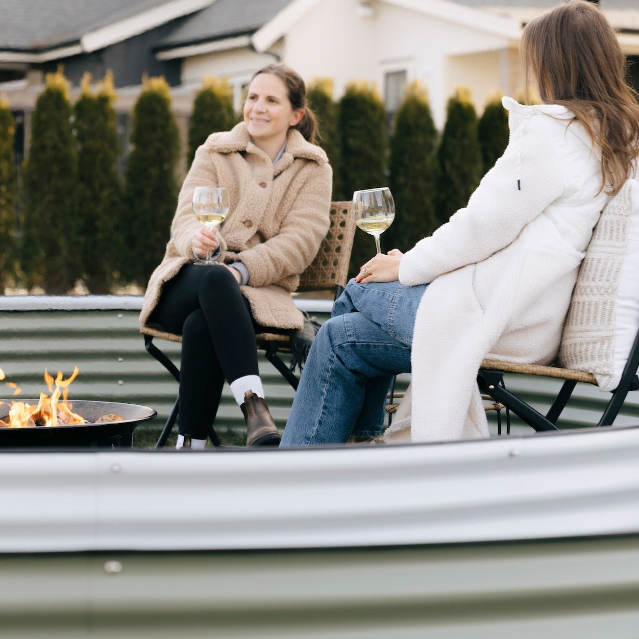 two women in a 17" nest garden bed  in Canada