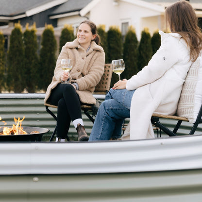 two women in a 17" nest garden bed  in Canada